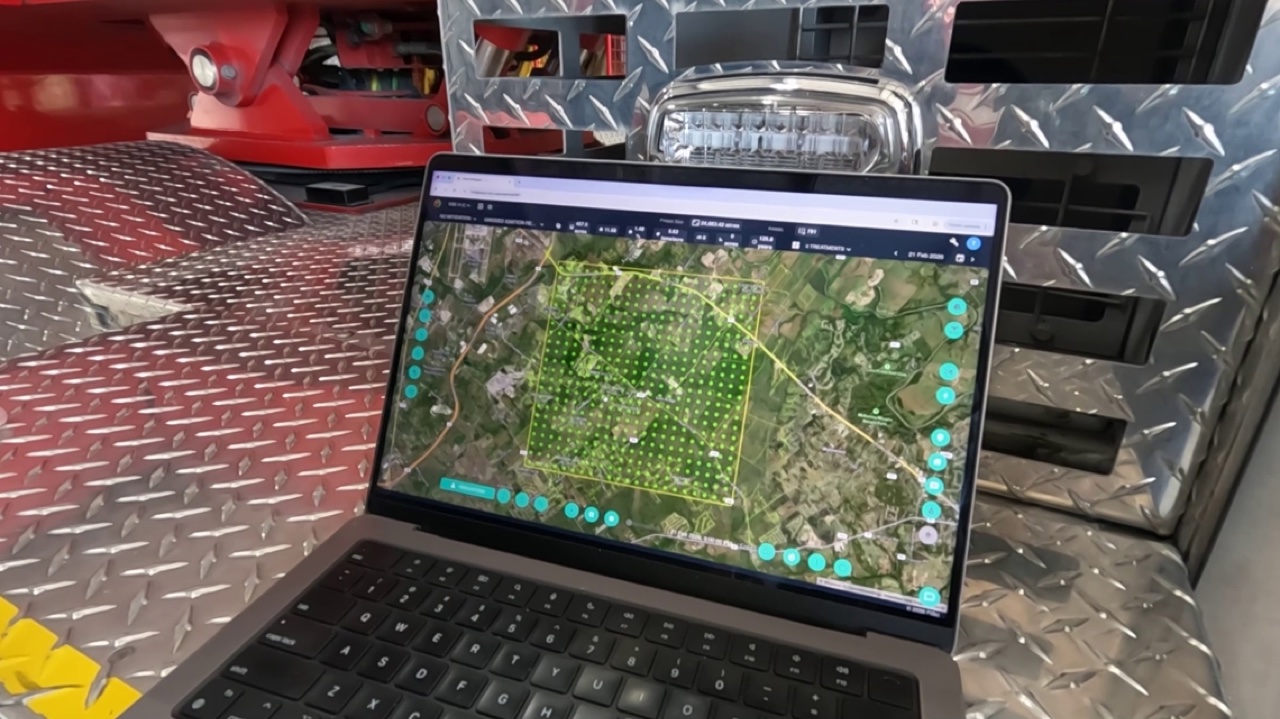 Mitigate wildfire modeling platform displayed on laptop at fire truck