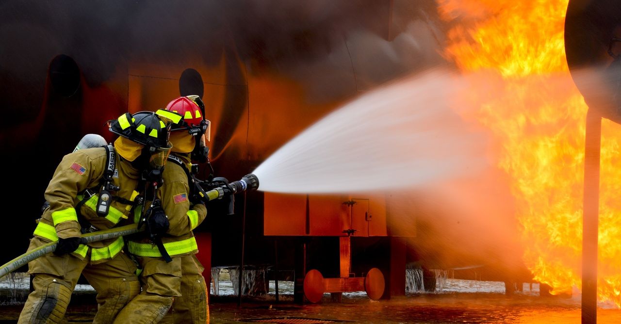 Firefighters in action during training