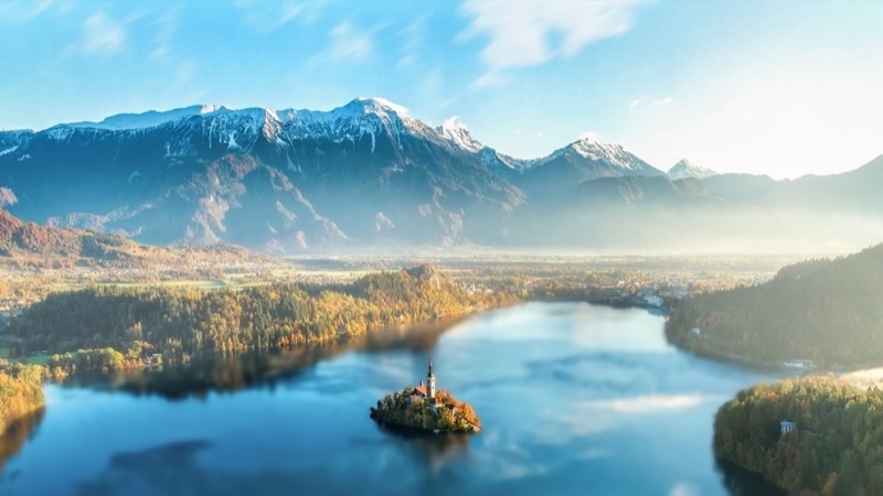 Mountain landscape with lake and atmospheric haze