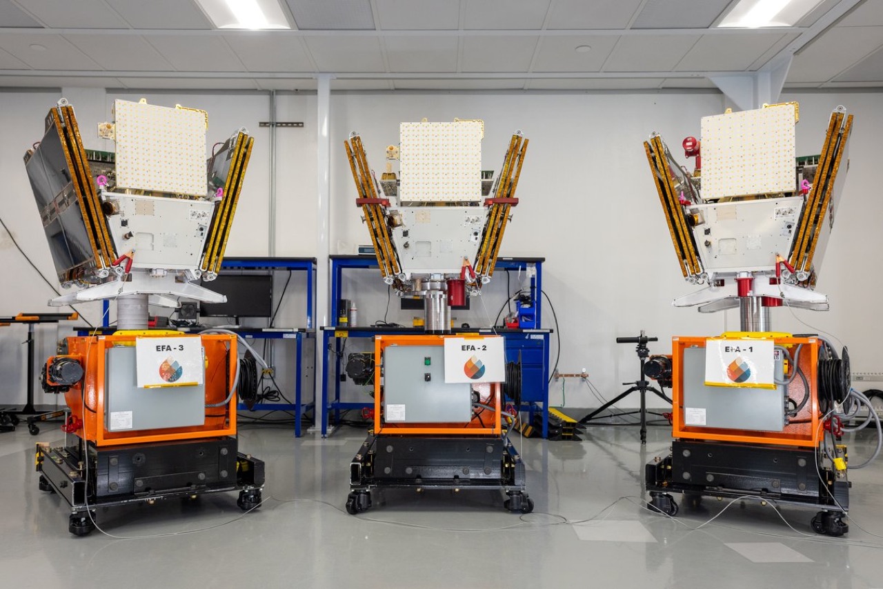 Three FireSat wildfire-detection satellites in a cleanroom ahead of launch