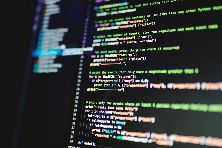 Close-up of programming code on a computer screen representing AI fire forecasting model development
