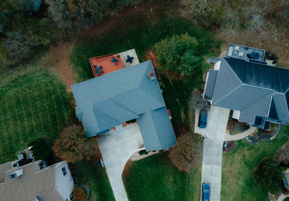 Aerial view of suburban residential neighborhood with houses and yards