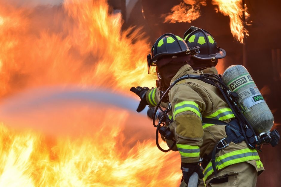 Firefighter in full gear and helmet during structural fire training